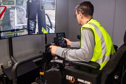 An operator uses the Cat® Simulators Next Generation Excavator system to learn how to operate Cat® Technology systems.