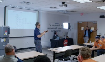 Tim House, Rheem master plumber conducts heat pump water heater training.