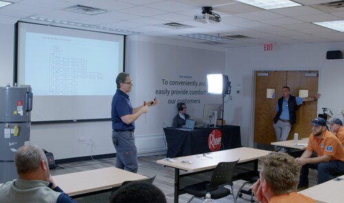Tim House, Rheem master plumber conducts heat pump water heater training.