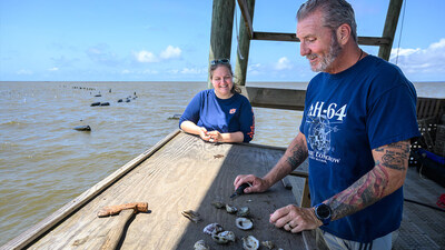 Auburn University doctoral student Jill Sower works with Gulf Coast oyster farmers like Hugh McClure, who owns Point aux Pins in Grand Bay, Alabama.