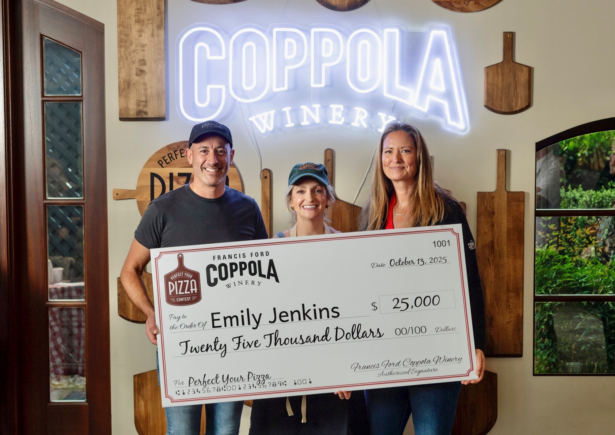 Emily Jenkins accepting the $25,000 Perfect Your Pizza grand prize.