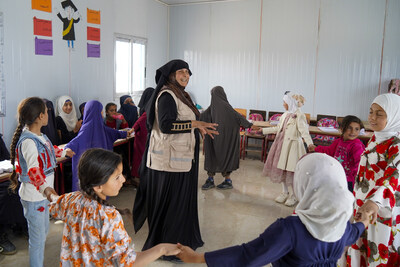 Teacher Rudayfah helps her students rebuild their futures through learning in a refugee camp in Syria, with support from an Education Cannot Wait-funded and UNICEF-led initiative, Teacher Rudayfah helps her students rebuild their futures through learning in a refugee camp in Syria, with support from an Education Cannot Wait-funded and UNICEF-led initiative,