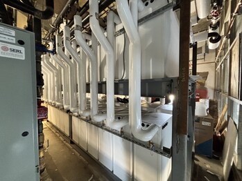 Central thermal storage system: 24 pairs of Thermino units working together to deliver scalable, efficient hot water and peak demand management for a large building. Central thermal storage system: 24 pairs of Thermino units working together to deliver scalable, efficient hot water and peak demand management for a large building.