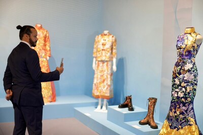 Visitors taking photos at the Chinese fashion section