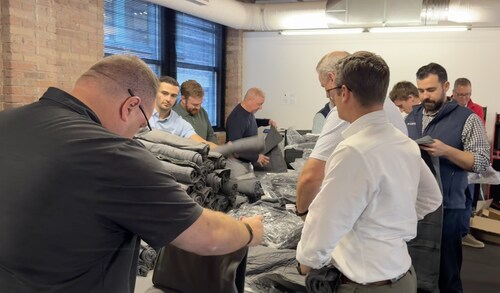 Liberty Advisor Group employees pack 300 care packages for patients. Liberty Advisor Group employees pack 300 care packages for patients.