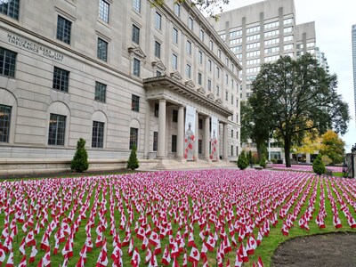 Manulife is planting more than 12,000 Canadian flags on the front lawn of its global headquarters to recognize and pay tribute to members of the Canadian Armed Forces (CAF) ahead of Remembrance Day. (File photo) (CNW Group/Manulife Financial Corporation)