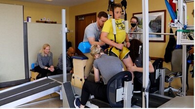 Malcolm MacIntyre is assisted during a therapy session on a treadmill by UofL Pediatric NeuroRecovery research staff and therapists and technicians with UofL Health - Frazier Rehabilitation Institute. Download high-res images and videos here: https://louisville.box.com/s/m1bqcauqshvgd2809a5z0h4nzlsrw72m The images with “study image” in the name were captured during the study sessions, 2021-2023. Malcolm MacIntyre is assisted during a therapy session on a treadmill by UofL Pediatric NeuroRecovery research staff and therapists and technicians with UofL Health - Frazier Rehabilitation Institute. Download high-res images and videos here: https://louisville.box.com/s/m1bqcauqshvgd2809a5z0h4nzlsrw72m The images with “study image” in the name were captured during the study sessions, 2021-2023.