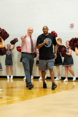 Clarksville Christian Director of Athletics Jason Shelton (left) ushers Clarksville Girls Basketball Coach Trenton Hassell (right) into the gym for a surprise celebration of his being named National Coach of the Year by the National Christian School Association in early October. Clarksville Christian Director of Athletics Jason Shelton (left) ushers Clarksville Girls Basketball Coach Trenton Hassell (right) into the gym for a surprise celebration of his being named National Coach of the Year by the National Christian School Association in early October.
