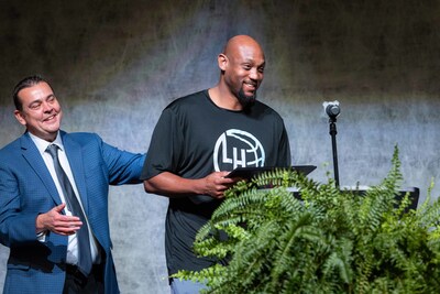 Coach Trenton Hassell accepts the National Coach of the Year award from the National Christian School Association. Coach Trenton Hassell accepts the National Coach of the Year award from the National Christian School Association.