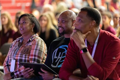 Coach Trenton Hassell (center) is surrounded by family, friends and colleagues as they celebrate his recognition as National Coach of the Year. Coach Trenton Hassell (center) is surrounded by family, friends and colleagues as they celebrate his recognition as National Coach of the Year.