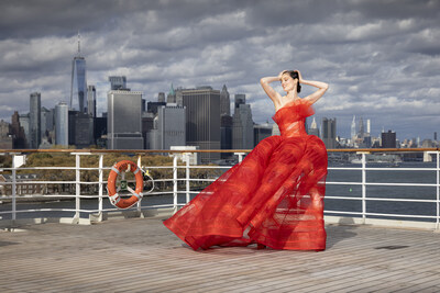 As Queen Mary 2 prepares to sail from New York, supermodel Coco Rocha stuns on deck in a dramatic red gown by Christian Siriano to mark the return of Cunard's Transatlantic Fashion Week.