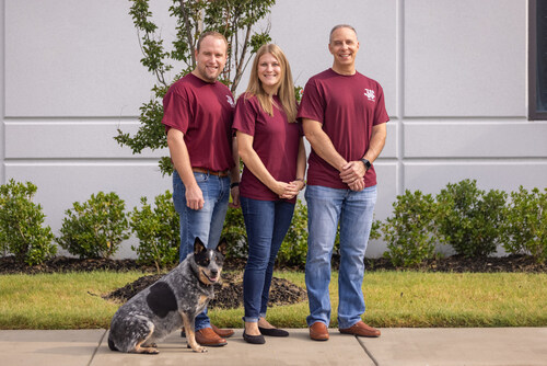 Ryon Ray, President & CEO; Heather Young, VP & CFO; Loren Sloane, GM & COO and Agua the Blue Heeler.