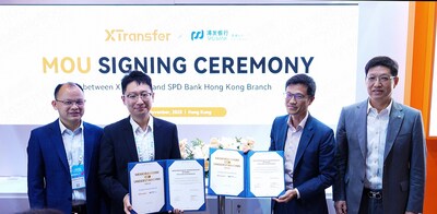 Bill Deng, Founder and CEO of XTransfer (From the Left), and Zhu Jun, Deputy Chief Executive Officer of Shanghai Pudong Development Bank Co. Ltd., Hong Kong Branch (From the Right), witnessed the official signing of a memorandum of cooperation at the XTransfer booth. (PRNewsfoto/XTransfer)