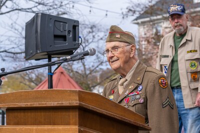 Corporal Wilbur "Jack" Myers will sing the National Anthem.