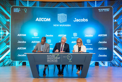 Image credit: New Murabba. From left: Jacobs Chair & CEO Bob Pragada, New Murabba CEO Michael Dyke, AECOM President Lara Poloni