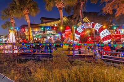This year, the MarshWalk Wonderland of Lights, in Murrells Inlet, SC, will feature synchronized lights, festive photo opportunities and a Santa’s Village from November 28 through December 31, 2025. Credit: Visit Myrtle Beach