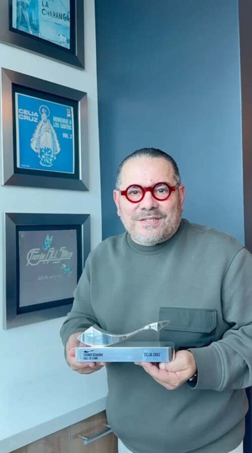 Omer Pardillo-Cid, Executor of the Celia Cruz Estate, with the SoundExchange Hall of Fame Award, honoring the late Celia Cruz. (Photo credit: Indira Pardillo) Omer Pardillo-Cid, Executor of the Celia Cruz Estate, with the SoundExchange Hall of Fame Award, honoring the late Celia Cruz. (Photo credit: Indira Pardillo)