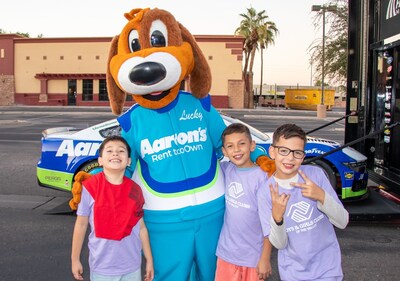 Lucky Dog and members of Boys & Girls Clubs of the Valley pose with the Aaron’s No. 38 Mustang Lucky Dog and members of Boys & Girls Clubs of the Valley pose with the Aaron’s No. 38 Mustang