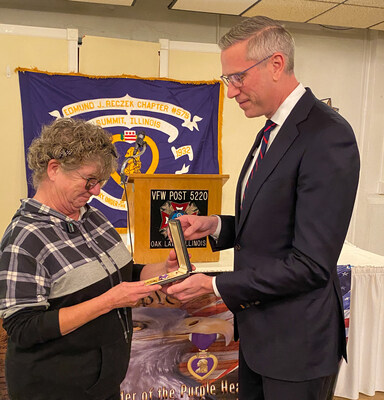 Illinois State Treasurer Michael Frerichs returned a lost Purple Heart medal to Patti Knies, niece of World War II Army Rifleman James R. Bennett, who was injured while fighting in France and Germany.  The ceremony was held the at VFW Post 5220 in Oak Lawn, IL and is the 17th lost medal Frerichs has returned as part of Operation Purple Heart, an unprecedented mission to reunite the military honor with veterans or their family members.