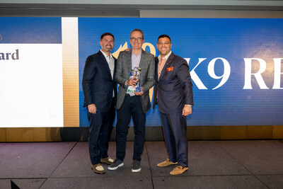 Glenn Vogelman accepting The Parker Award alongside Jason and Steven Parker