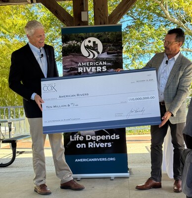 Mark Greatrex, President of Cox Communications, presents a check on behalf of the James M. Cox Foundation to Tom Kiernan, President and CEO of American Rivers, for the Life Depends on Rivers campaign.