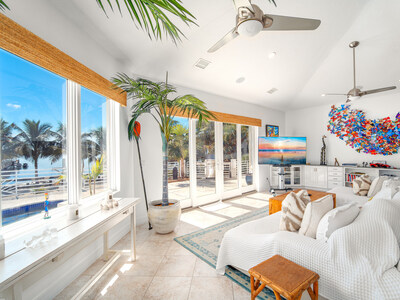 Lofted ceilings, floor-to-ceiling windows and sliding glass doors provide beautiful ocean views and allow the interiors to fill with natural light, while providing seamless integration of indoor and outdoor living areas. FloridaKeysLuxuryAuction.com.