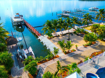Dockage amenities will impress even the saltiest of boat owners They include a concrete boat slip, 200-ft teak dock with electrical/water service and fish-cleaning station, 120,000-lb boat lift and 2 smaller lifts for additional watercraft. Three (3) underwater bubbler systems were also installed to minimize seagrass accumulation. FloridaKeysLuxuryAuction.com.