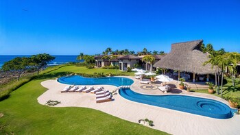 Aerial view of Punta Mita’s private beachfront estates surrounded by the Pacific Ocean.