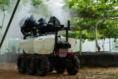 XAG R200 agricultural rover performs precision spraying in a vineyard.