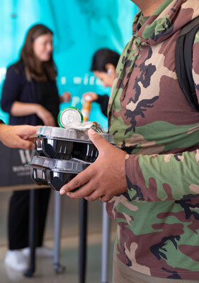 A student at the University of the District of Columbia receives donated meals from Scholarship America. Photo by LAFlicks.