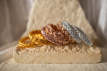 Timeless texture, spiritual strength. Our braided bangles are made to move with you.