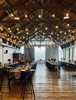 Ederer Hall's 5,500 sq. ft. venue, showcasing its original exposed wooden beams, soaring ceilings, and warm string lighting, ready for a large community or corporate event