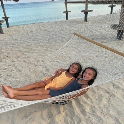 Children in hammock on Palm Beach at Divi Aruba Phoenix Beach Resort Children in hammock on Palm Beach at Divi Aruba Phoenix Beach Resort