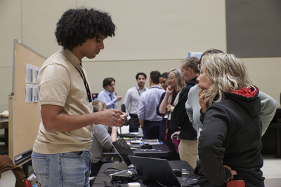 Yassine Mrabet, a doctoral student, shows a “hearable,” a device capable of capturing sounds inside the ear. His research supervisor, Rachel Bouserhal, oversees the Marcelle-Gauvreau Research Chair in Engineering on multimodal health monitoring and early disease detection using hearing aids. Photo credit: Catherine Alegre (CNW Group/École de Technologie Supérieure)