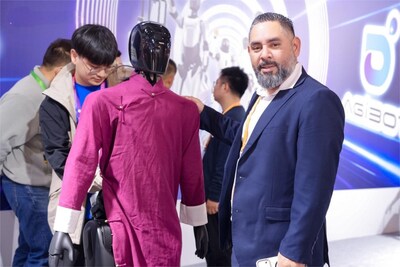 Visitor interacts with AgiBot A2 at CIIE