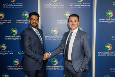 Tareq Amin, CEO of HUMAIN, shakes hands with Amit Jain, CEO & Co-founder Luma AI