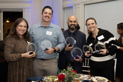 The Merlot Marketing team accepts 6 awards for outstanding client work, including an Influence Award in the Special Events category for Empava at the 2025 Kitchen and Bath Industry Show.