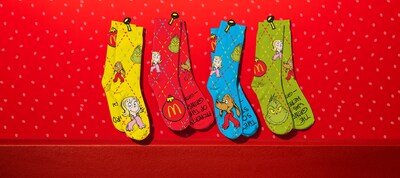 The Grinch is also sneaking a piece of mischief into every meal: a pair of spirited socks, scribbled with messages from the Grinch himself to let everyone know exactly how he feels this holiday season.