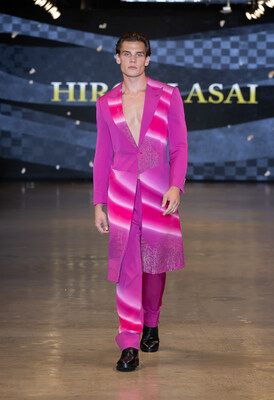 Fulop Budavari wears a striking HIROMI ASAI look crafted from luminous Japanese kimono textiles, presented at Los Angeles Fashion Week (LAFW) powered by Art Hearts Fashion. This vibrant silhouette highlights the brand's signature fusion of heritage craftsmanship and modern menswear design. (Photo by Mark Gunter/Getty Images)