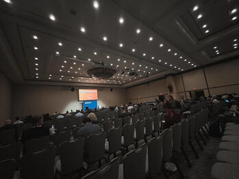 The stage at Gartner IAM Texas 2024 before a packed-out session by Admin By Request on how to stop overloading your IT team by effectively managing privileged access.