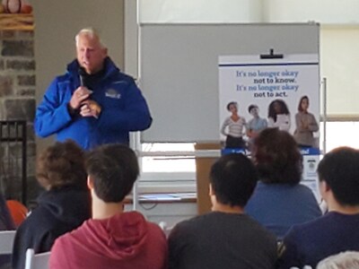 Joe Richardson, Past President of the Rotary Club of Southern Frederick County, speaks to local middle and 
high school students during the club’s Youth Environmental Summit