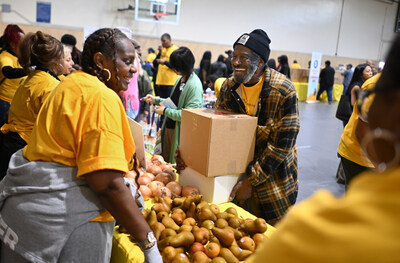Eaton fire survivor picks up a Thanksgiving box in Pasadena.