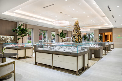 The showroom features high ceilings and abundant natural light with floor to ceiling windows