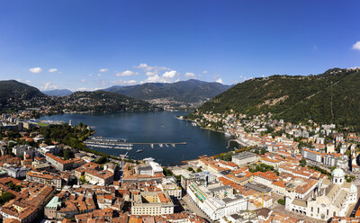 Aerial panorama of the Como old town by lake Como on a sunny summer day in Lombardy, Italy