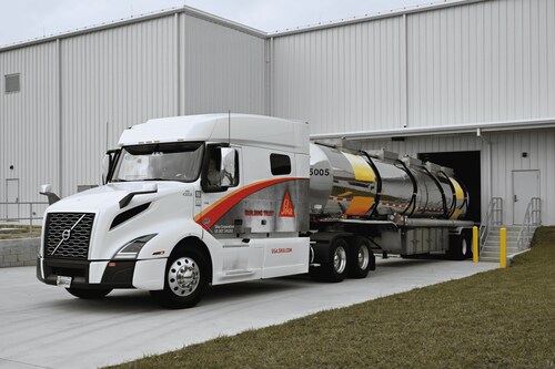 A Sika-branded truck with a chemical tanker trailer is parked outside the loading bay of Sika’s new Haines City Admixture Plant in Florida.