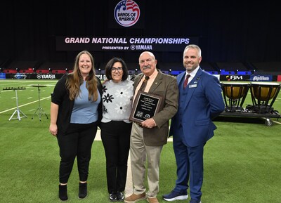 Left to right: Katherine Prihoda, NAfME Council for Band Education Co-Chair and North Central Division Representative; Dena and Gary Gilroy; and Dr. James Weaver, Music for All CEO and President. Left to right: Katherine Prihoda, NAfME Council for Band Education Co-Chair and North Central Division Representative; Dena and Gary Gilroy; and Dr. James Weaver, Music for All CEO and President.