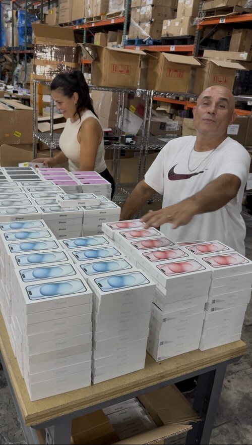 Robert Steve Statello overseeing inventory operations at ST Distribution USA LLC’s Miami warehouse, preparing a large shipment of new iPhones for distribution across Latin America.