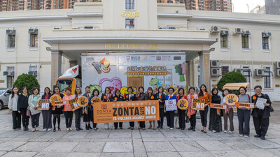 Zonta International District 17 Governor Mrs Winnie Wong (11th left), Zonta International District 17 Area 2 Director Ms Thelma Tong (12th right), along with presidents of seven Zonta Clubs in Hong Kong and other members in front of the Po Leung Kuk "Violence? Love!!: A Voyage of Discovery” mobile art exhibition vehicle. (PRNewsfoto/Zonta Clubs in HK)