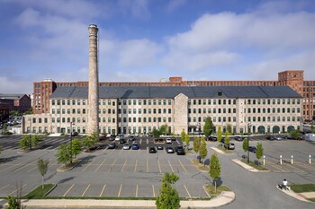 TAT is deeply committed to sustainability. Many of the firm's projects, such as Stone Mill Lofts, utilize Passive House principles to enhance efficiency (Photo Credit: Ed Wonsek).