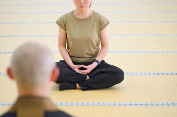 Zazen (Zen meditation) guided by a Zen master